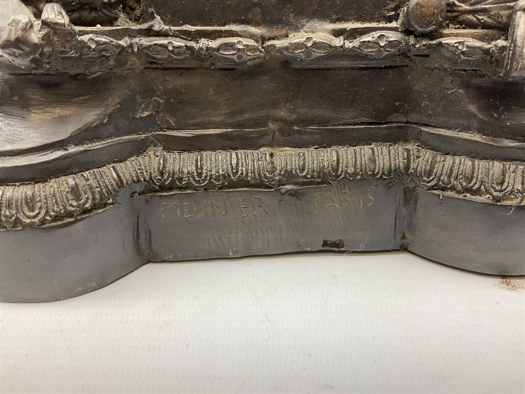 Large and impressive bronze figure of Wellington seated on a horse, on a sarcophogus shaped stepped base impressed 'Meunier Paris', the canted corners inset with battle trophies H68cm L50cm D22cm