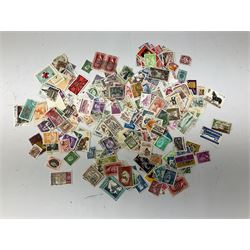 Comic postcards including Bamforth and Quip examples together with WW1 postcards, a collection of world stamps including examples from China, and other ephemera 
