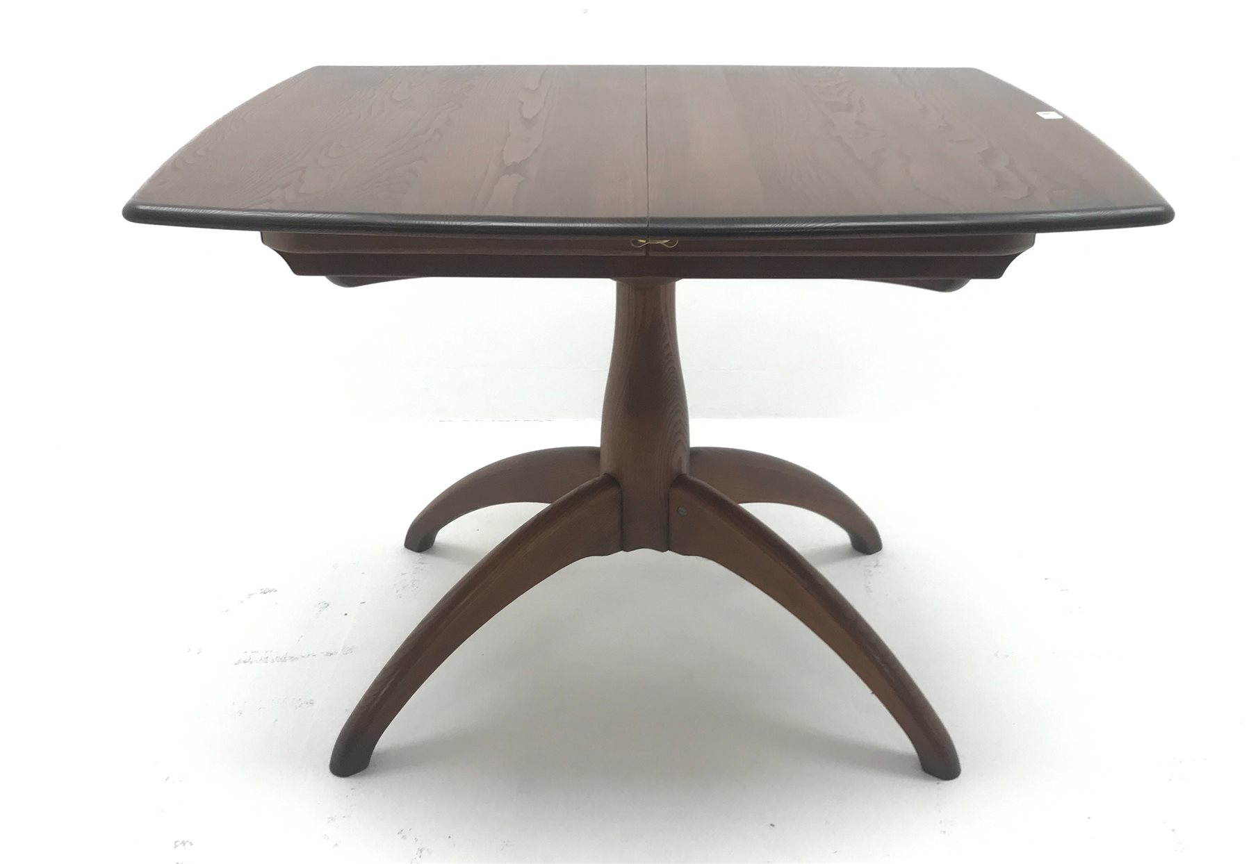 Ercol Windsor dark elm extending pedestal dining table, turned column