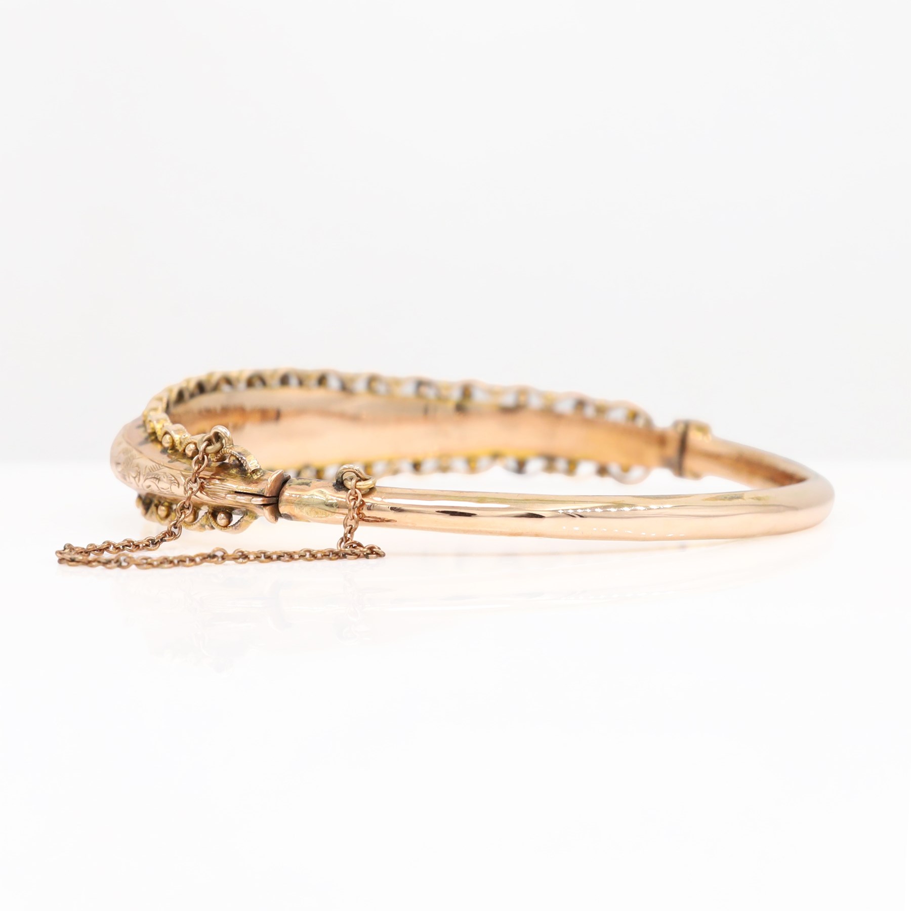 Edwardian 9ct rose gold bangle, with engraved decoration and wirework and bead work surround, Chester 1904