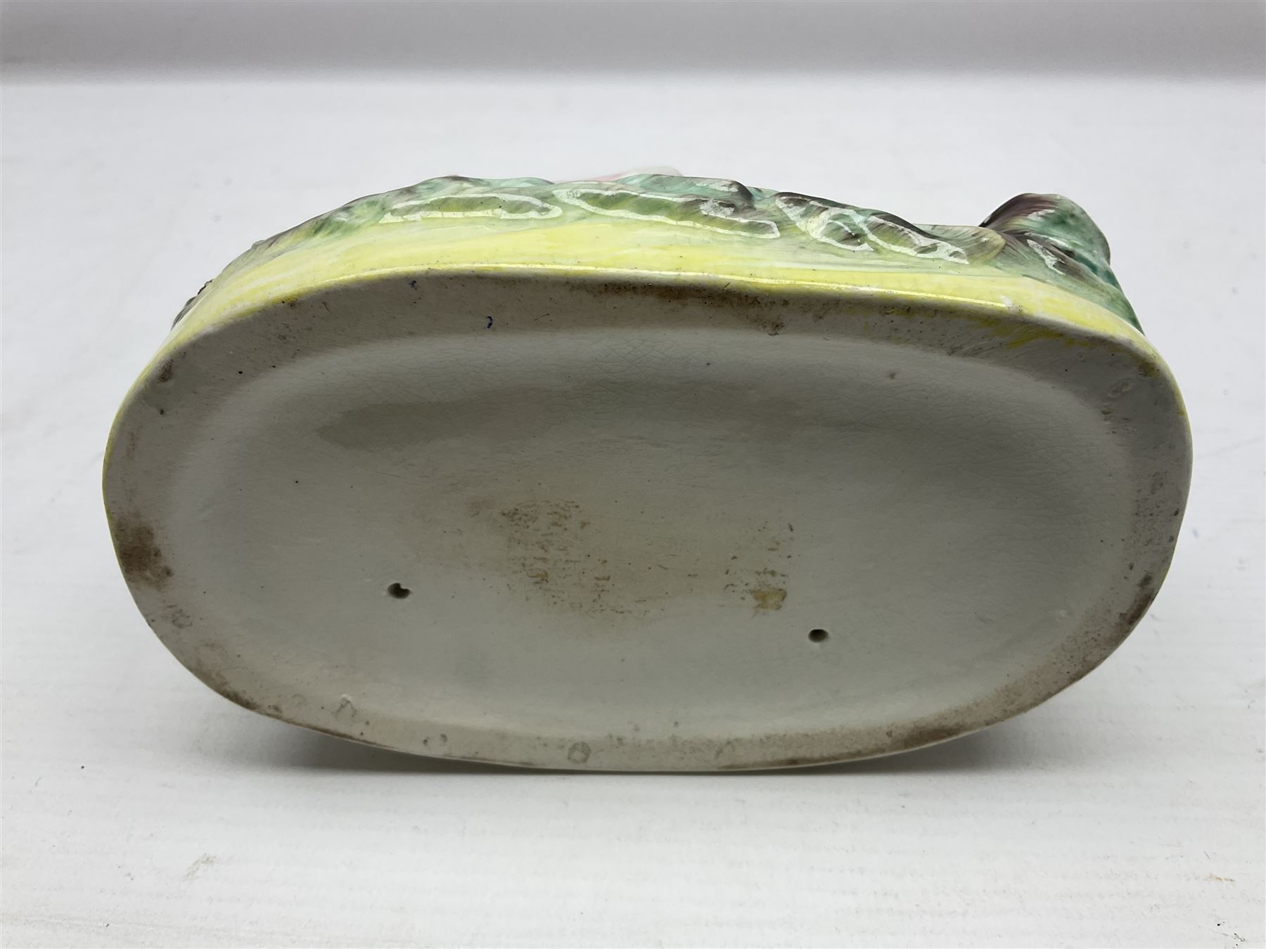 20th century Clarice Cliff Bizarre Crocus pattern bowl, printed marks beneath, D13cm, Staffordshire figure group, and a small tea bowl