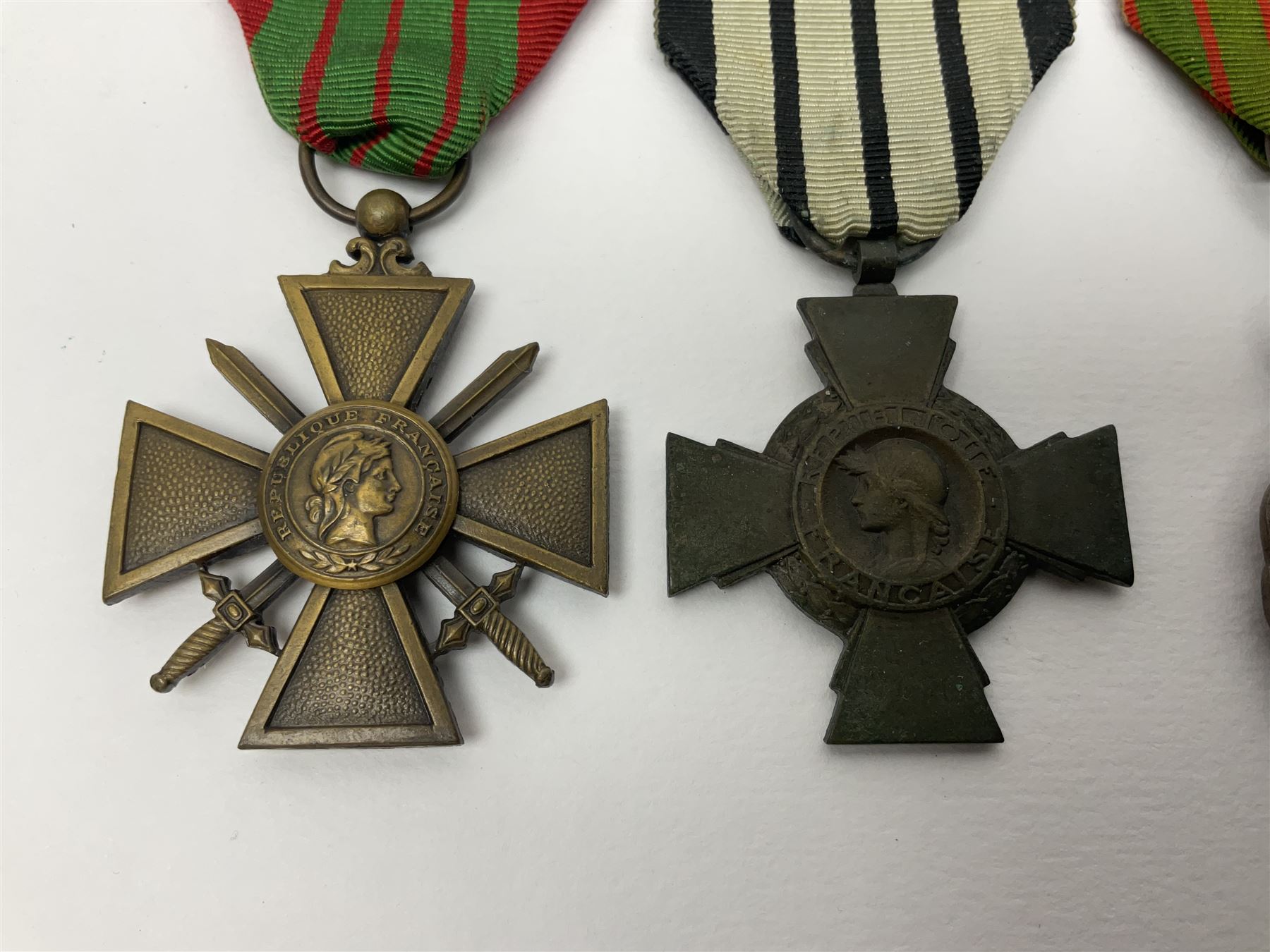 Four French medals - St. Helena medal with bust of Napoleon to obverse and inscription to reverse 'Campagnes de 1792 a 1815. A ses compagnons de gloire sa derniere pensée Ste. Hélène 5 Mai 1821', established by Emperor Napoleon III in 1857; two WW2 Croix-de-Guerre; and WW2 Croix-du-Combattant; all with ribbons (4)