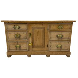 19th century stripped pine dresser base, fitted with six drawers and centre cupboard
