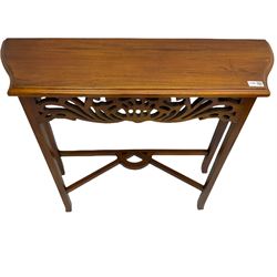 Mahogany console table, shaped moulded top over pierced apron, square supports