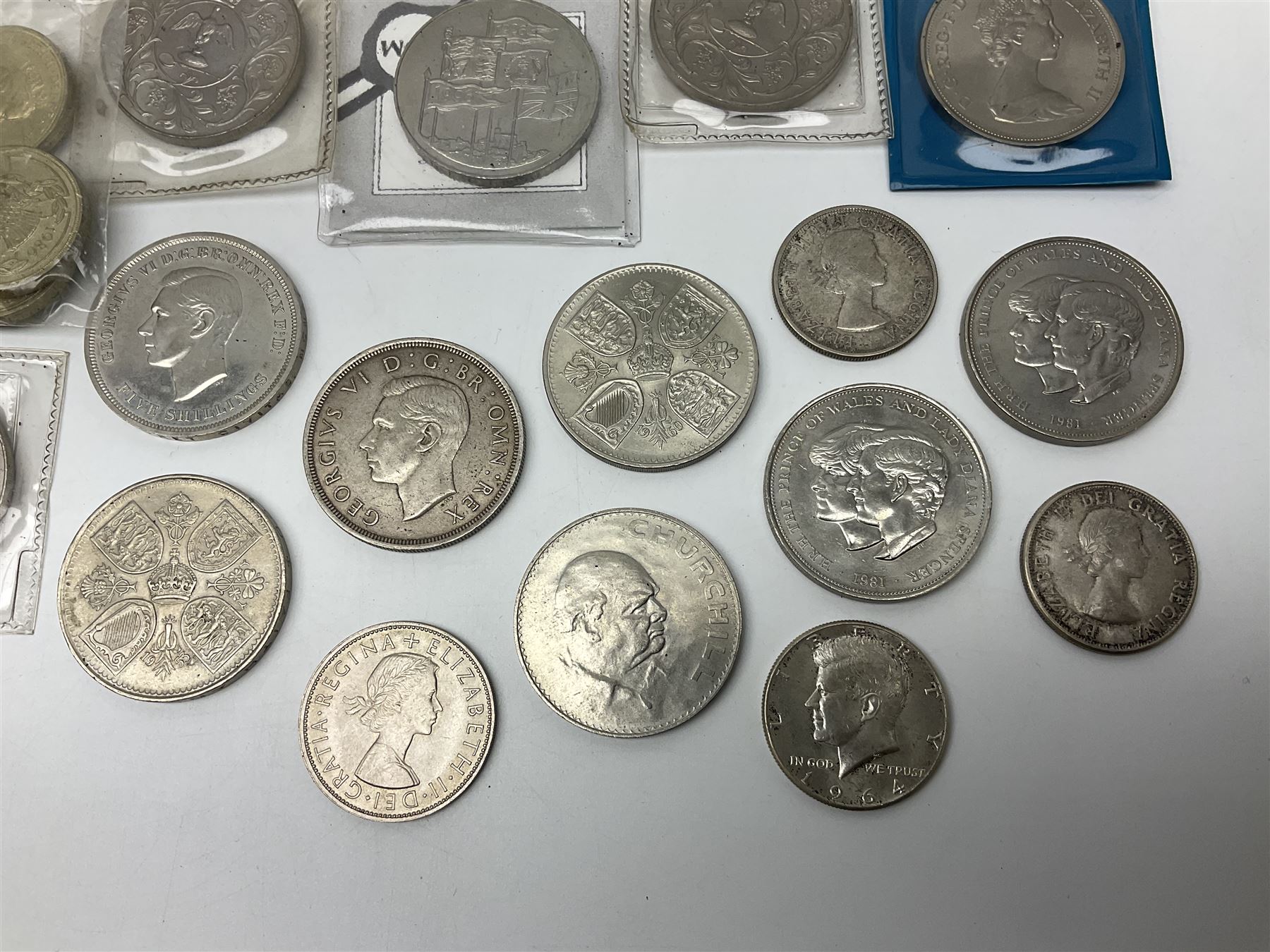 King George VI 1937 crown coin, various commemorative crowns, Queen Elizabeth II Canada 1957 and 1959 fifty cent coins, four Great British five pound coins, United States of America 1964 half dollar etc