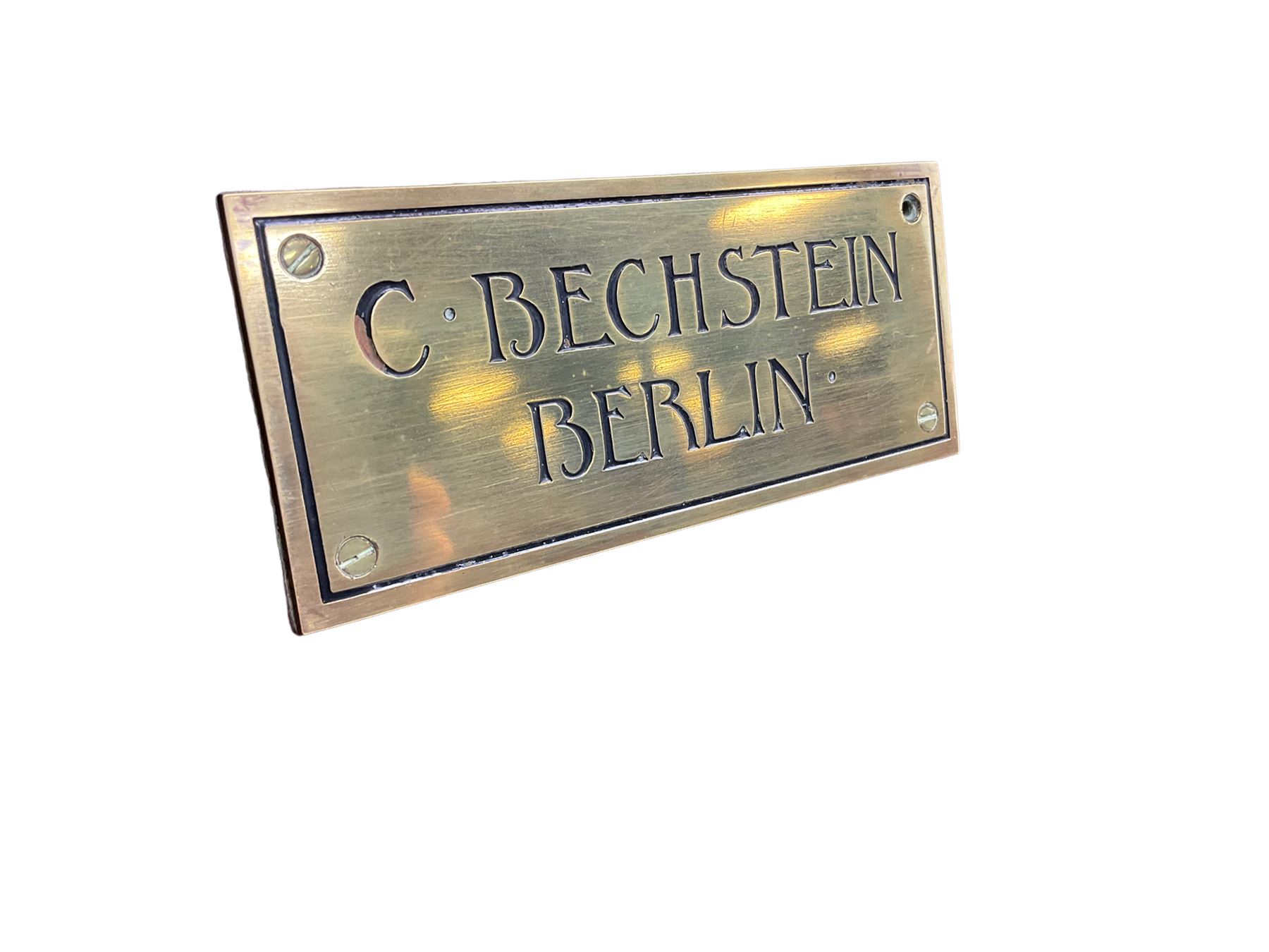 Carl Bechstein - late 19th century German overstrung upright piano, in a model 4 Arts and Crafts case designed by Walter Cave, with a lattice music desk and fretted silk backed front panel, brass hinged case lid and key fall with square tapered candle holders and circular sconces, iron frame, serial number 52187 (1899-1900), with an under damper action, 85 ebony and ivory keys, sustain and una corda pedals, original action, stringing, dampers, and action return straps, registered case number 328639, USA patent 24805.

This item has been registered for sale under Section 10 of the APHA Ivory Act