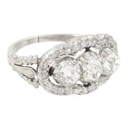 Late 19th / early 20th century platinum diamond ring, three old cut diamonds, in an openwork setting surrounded by further old cut diamonds, with pierced design shoulders, principal three diamonds total weight approx 1.45 carat, in a velvet and silk lined box by Selfridges