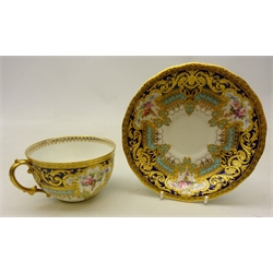  Royal Crown Derby breakfast cup and saucer from the Judge Elbert Henry Gary service, circa 1910, hand painted by Albert Gregory, signed, with baskets of flowers in cartouche shaped panels on cobalt blue and turquoise ground with raised gilded border incorporating an oval medallion with the initial 'G' by George Darlington, signed, printed back stamp in gilt with Royal Warrant and Tiffany & Co retailer's mark, saucer D16cm cup D10cm (2) Provenance Property of Bob Heath, Brandesburton Formerly of Ravenfield Hall Farm near Rotherham  