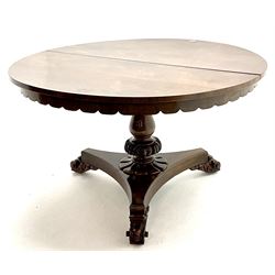 Early Victorian rosewood circular tilting dining table, turned column support on trefoil base with carved scrolling feet
