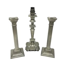 Pair of Corinthian column candlesticks, and a silver plated lamp, candlesticks H26cm