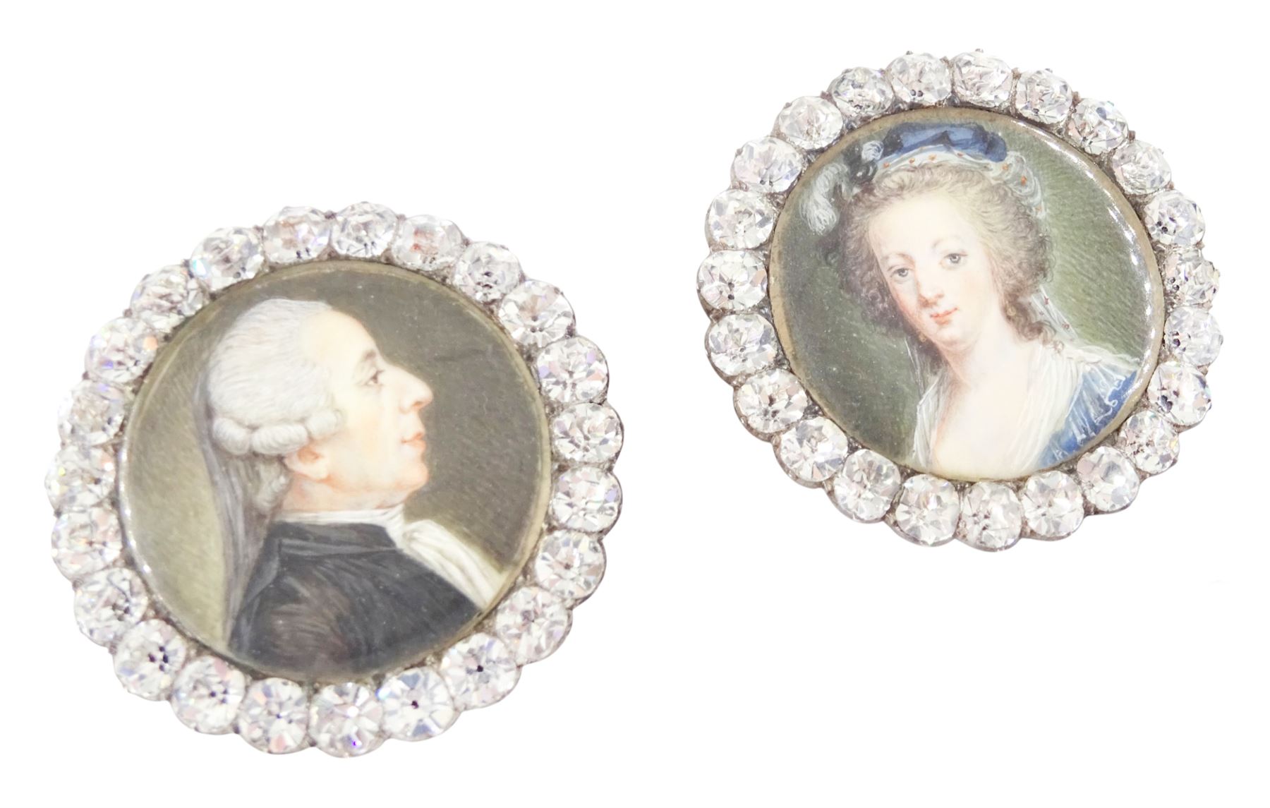 Set of six late 18th century French portrait miniature buttons, each finely painted upon ivory with a likeness of notable figures of the French Royal Court, set under glazed panels within silver frames mounted with paste stones, engraved verso with the sitters’ names and fitted with eyelets, later adapted with suspension rings; comprising “LE ROY” (Louis XVI), “LA REINE” (Marie Antoinette, youth portrait), “LA REINE” (Marie Antoinette, mature portrait), “MADAME” (Maria Josepha of Savoy, 1771–1810, wife of Louis, Comte de Provence, later King Louis XVIII), “M. BAILLY” (Jean Sylvain Bailly, 1736–1793, Mayor of Paris), and “M. L’ABBÉ MAURY” (Jean-Siffrein Maury, 1746–1817, Cardinal and Archbishop of Paris), overall D3.5cm. This lot has been registered for sale under Section 10 of the APHA Ivory Act