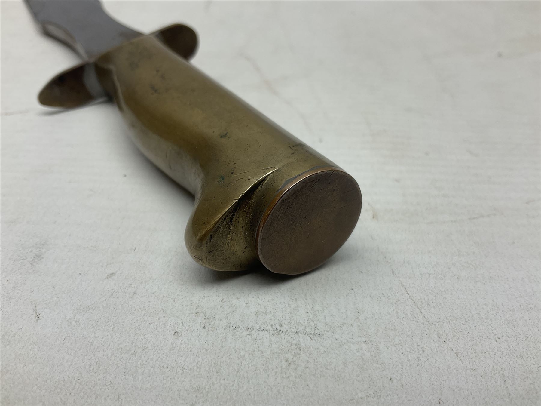 Scratch-built fighting/throwing knife, probably trench art, with 18cm steel spear type blade, plain cross-piece and French Lebel Rifle bayonet grip; in bras mounted studded leather sheath with belt hanger L29.5cm overall