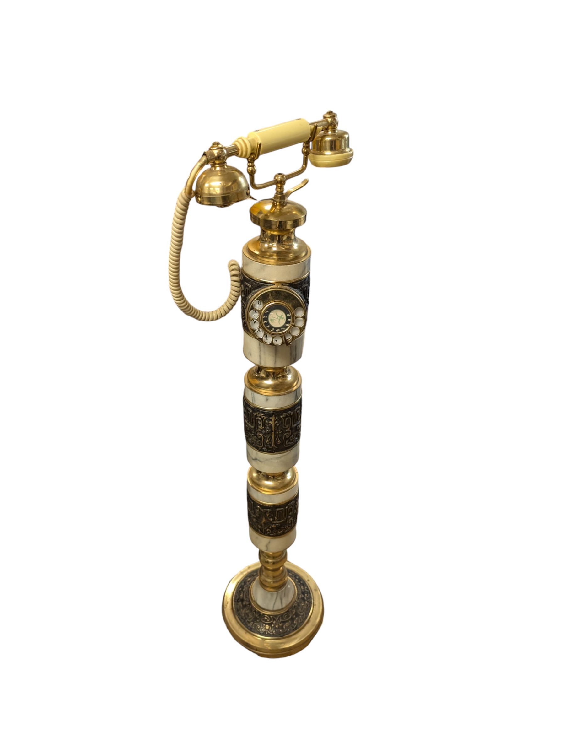 Tall Eastern brass and marble telephone, H105cm
