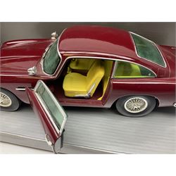 Chrono - two 1:18 scale die-cast models comprising Aston Martin DB5 1963 in 'Peony Red' and Triumph Spitfire Open Convertible 1970 in 'White'; both boxed (2)