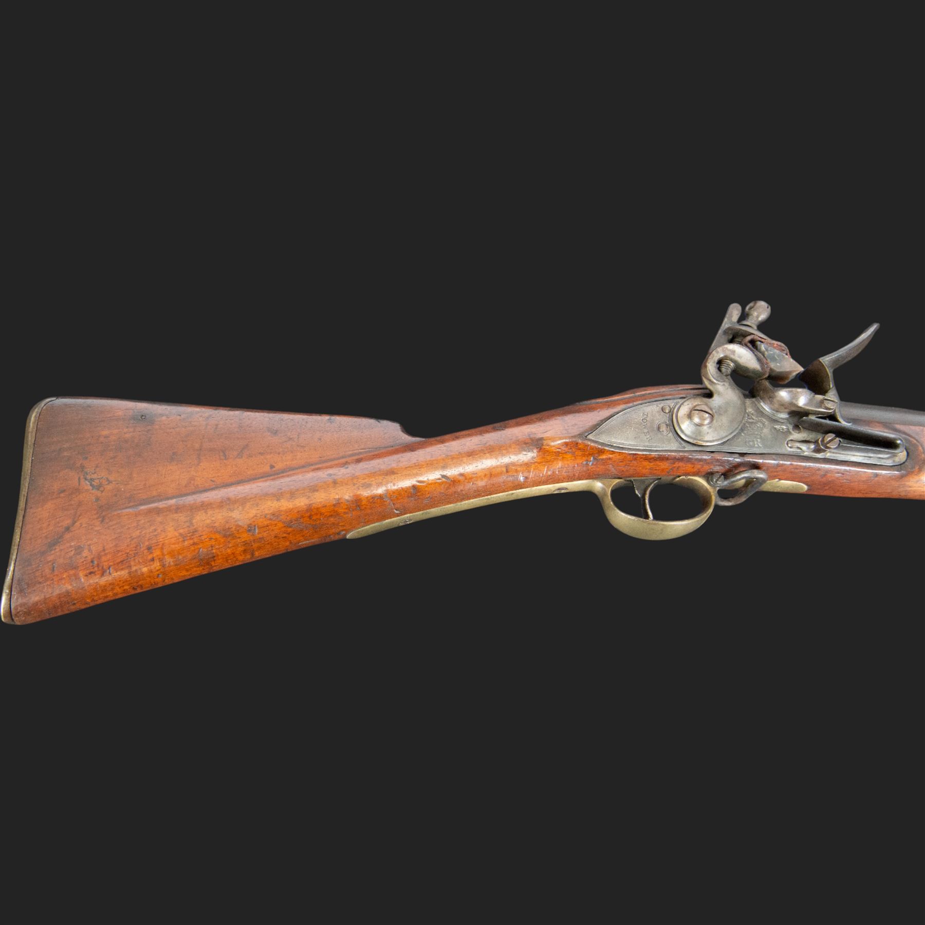 Brown Bess flintlock musket, 37in barrel, action marked with crowned GR and Tower, with brass mounts, the thinned butt marked 38, sling swivels, steel ramrod, overall L132cm
