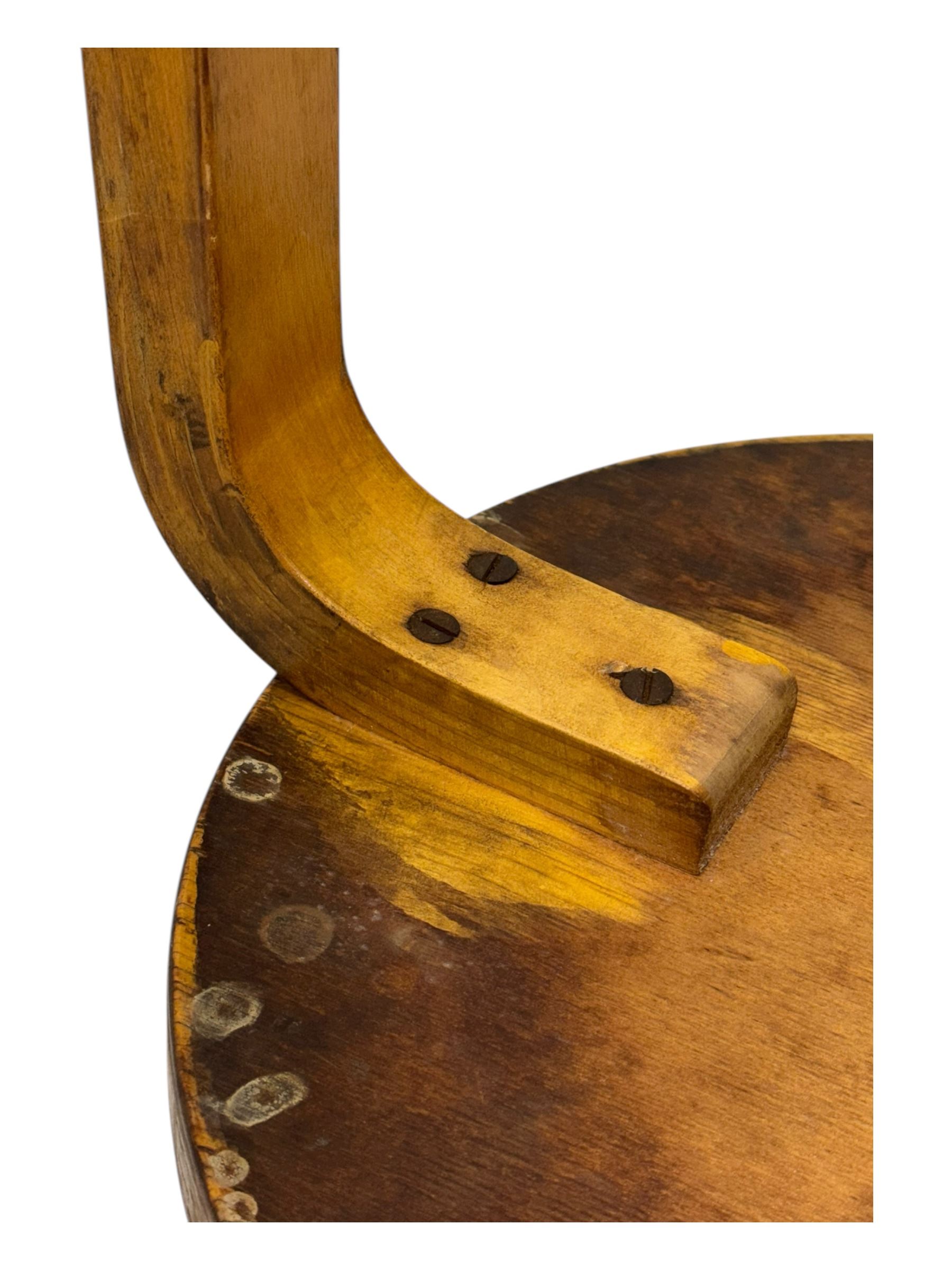 Alvar Aalto for Finmar - mid-20th century Finnish birch circular stool, the seat supported by three bentwood supports, applied label to the underside 