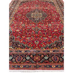 Persian Kashan rug, overall geometric design, angular interlaced decorated field with stylised plant motifs, central medallion, the main border band decorated with geometric motifs 