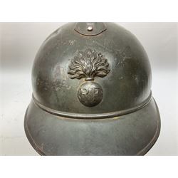 WW2 French M-26 Adrian Pattern Steel Helmet, original olive drab paint finish; flaming grenade badge to the front signifying issue to an Infantry regiment; original leather liner and leather chinstrap; and WW2 Dutch steel helmet with liner and chin strap (2)