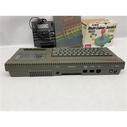 Sinclair ZX Spectrum +2 128k, Sinclair joystick, RAM Turbo joystick add-on, Comcon joystick interface, Power Supply Unit, unassociated multi-colour joystick, original instruction manual and a quantity of mostly Spectrum 48k games