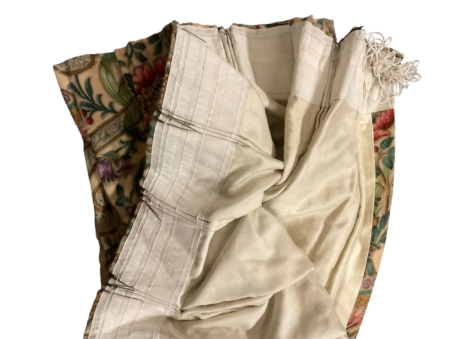 Two pairs of lined curtains, ivory ground fabric decorated with jardinieres of flowers spaced by scroll motifs, W329cm, fall 237cm (2)