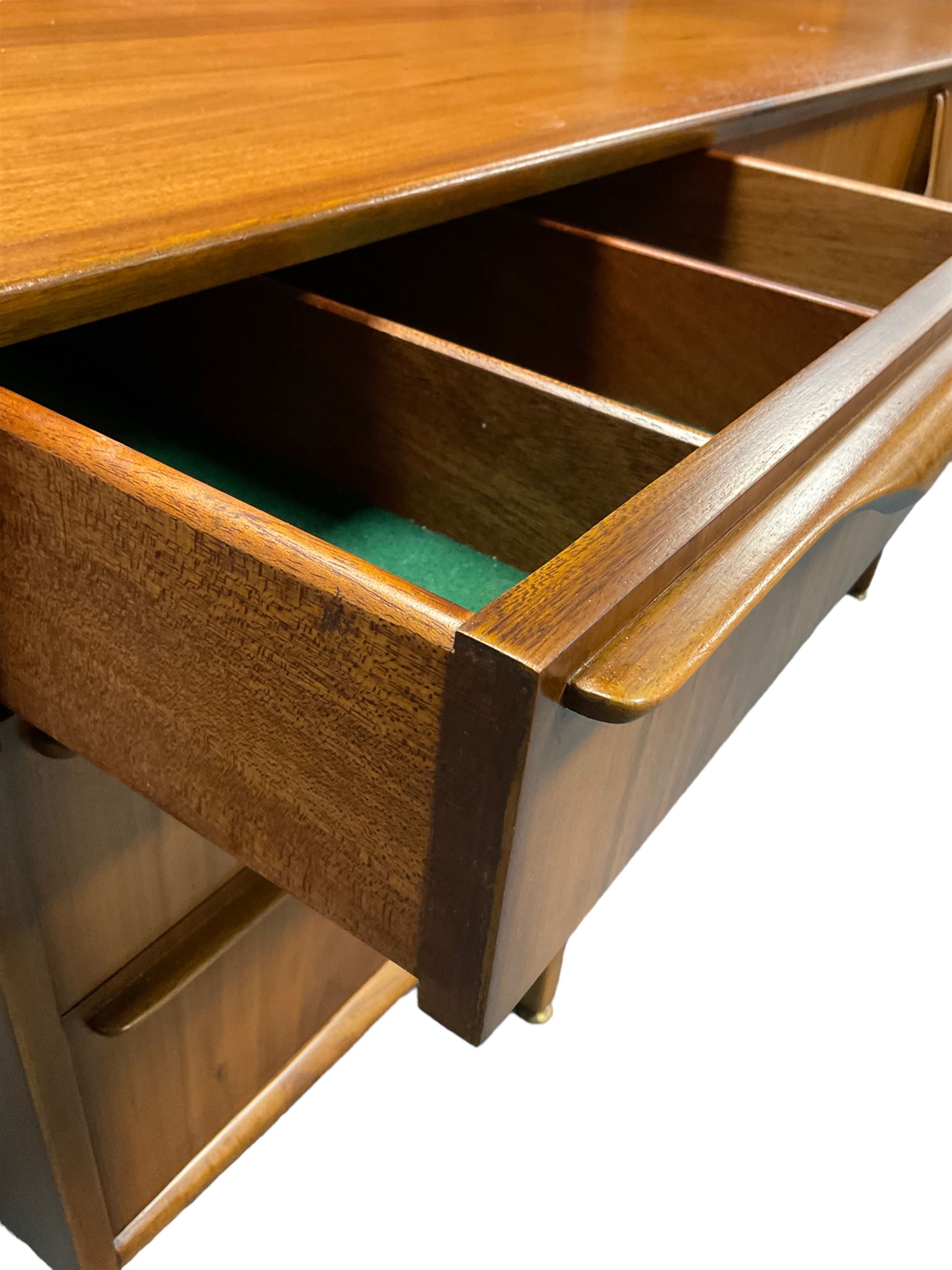 Jentique - mid-20th century teak sideboard, fitted with three drawers, double cupboard and fall front cupboard, raised on tapering supports