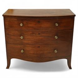 Late George III mahogany bow-fronted chest, the moulded top over three long graduating drawers fitted with turned brass knobs and brass-lined escutcheons, the shaped apron and splayed bracket supports