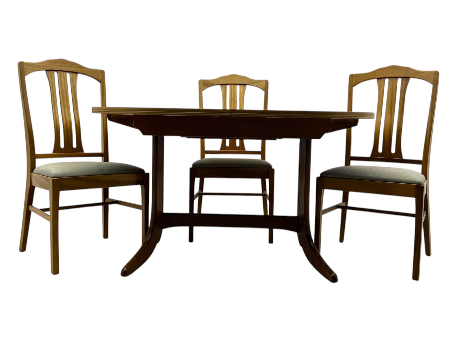 G-Plan - mid-20th century teak extending dining table, oval top with concealed central butterfly leaf extension, raised on splayed supports with cross-stretcher; three dining chairs with curved top rail and vertical splats