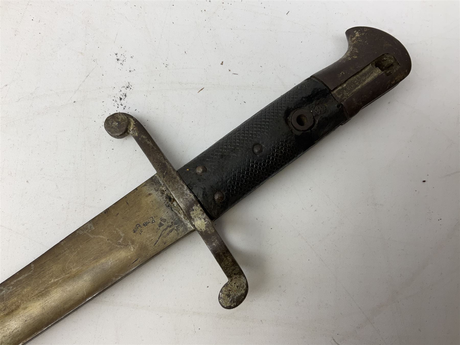 French Model 1866 sabre bayonet with 57cm fullered steel curving blade; in steel scabbard L71cm overall; another Model 1866 sabre bayonet lacking scabbard; and British Pattern 1856 sword bayonet (no scabbard) (3)