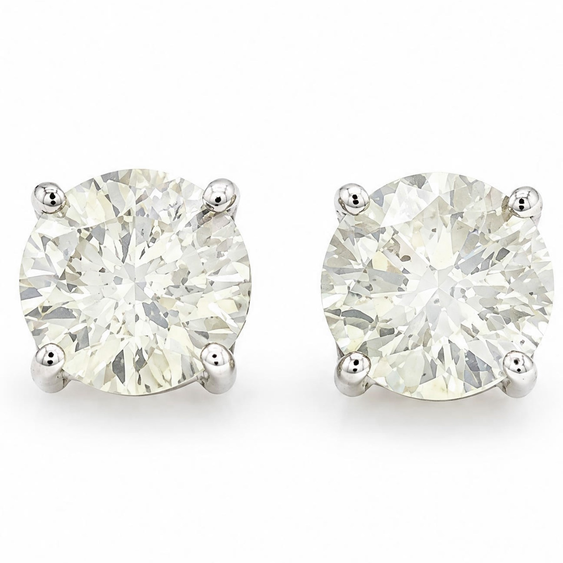 Pair of 18ct gold diamond earrings, each stud four claw set with a round brilliant cut diamond, stamped 750, total diamond weight approx 2.20 carat