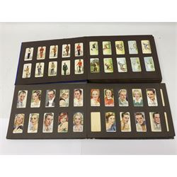 Four albums of cigarette cards, including Will's and Player's examples