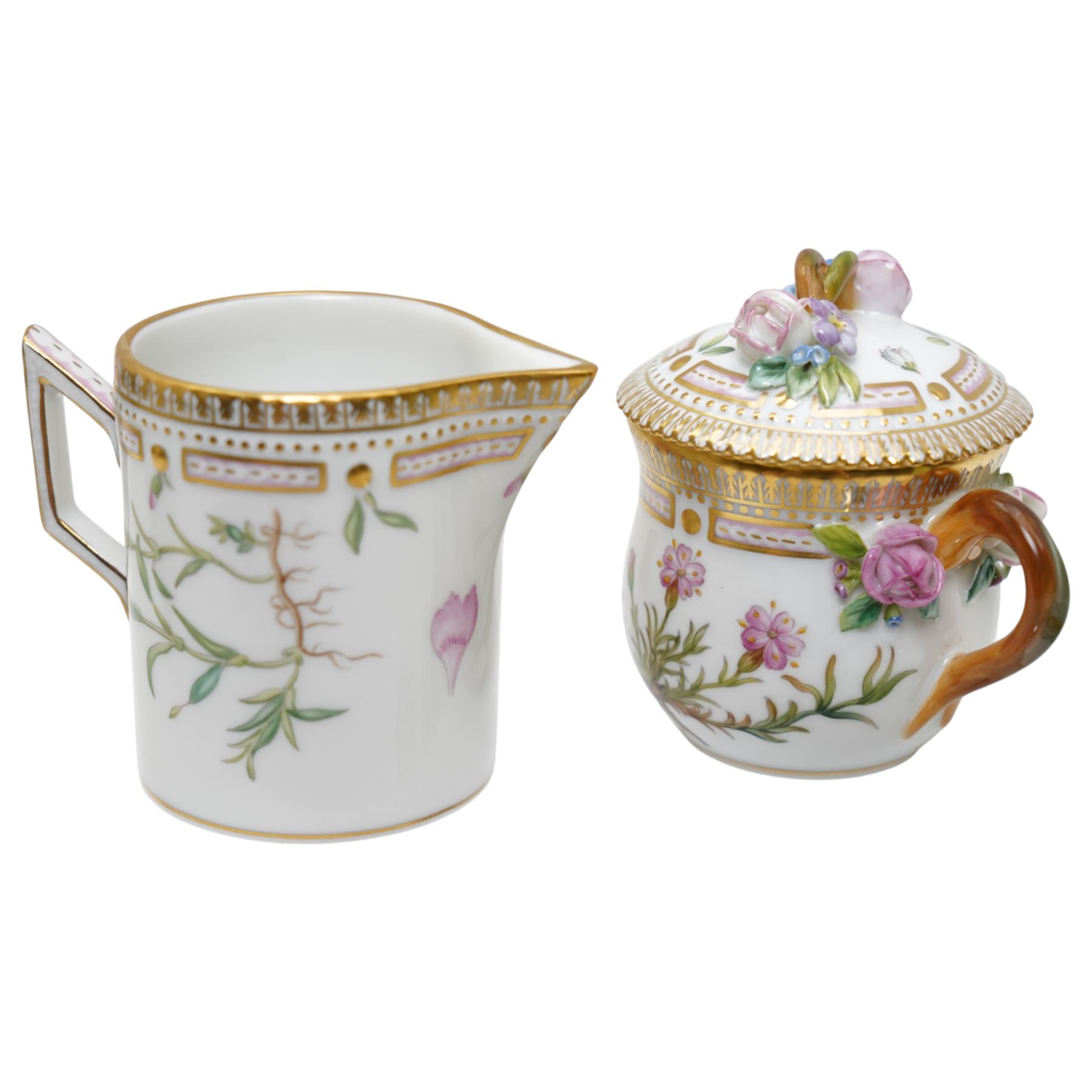 Royal Copenhagen Flora Danica wares, comprising covered mustard pot with naturalistically modelled vine handles and decorated with Cushion Pink (Cucubalius Acaulis) H8cm, milk jug decorated with Maiden Pink (Dianthus Deltoides) H7cm, covered dish decorated with Dwarf Milkwort (Polygala Amarum) W8cm, oval salt cellar decorated with Alpine Squill (Scilla Bifolia) W11cm, egg cup, pin dish and cased hand mirror, various Latin specimen inscriptions to base, all with printed and painted marks beneath (7)