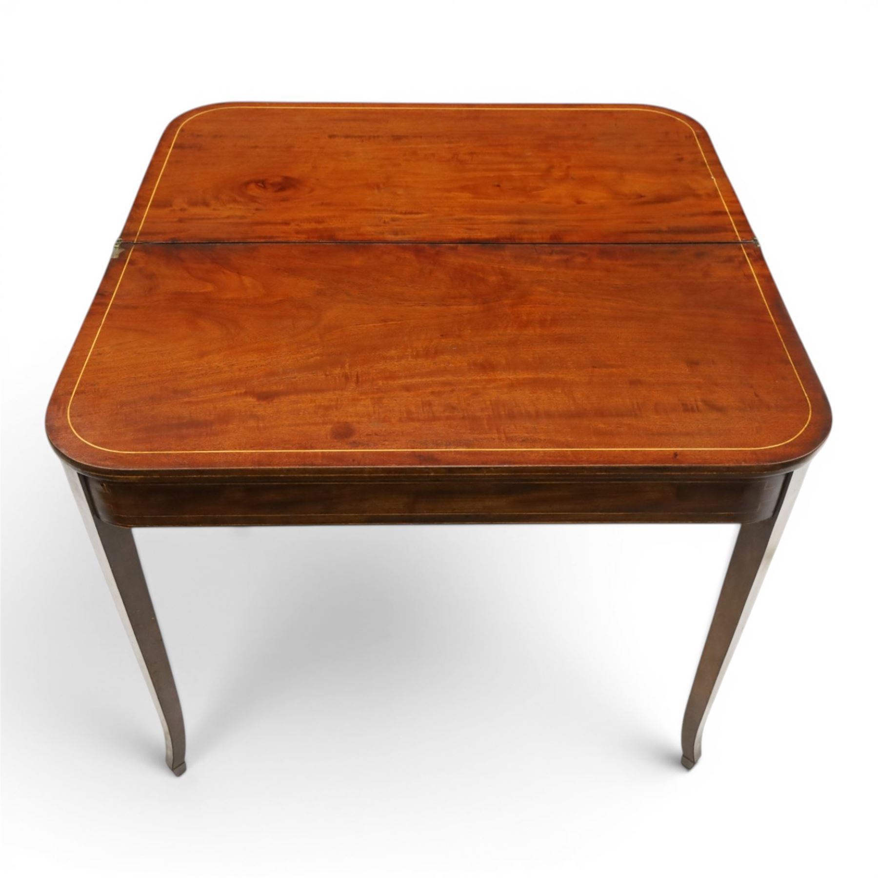 George III mahogany tea-table, the D-shaped rectangular fold-over top with satinwood stringing, raised on elegant square tapering and splayed supports with spade feet and gate-leg action