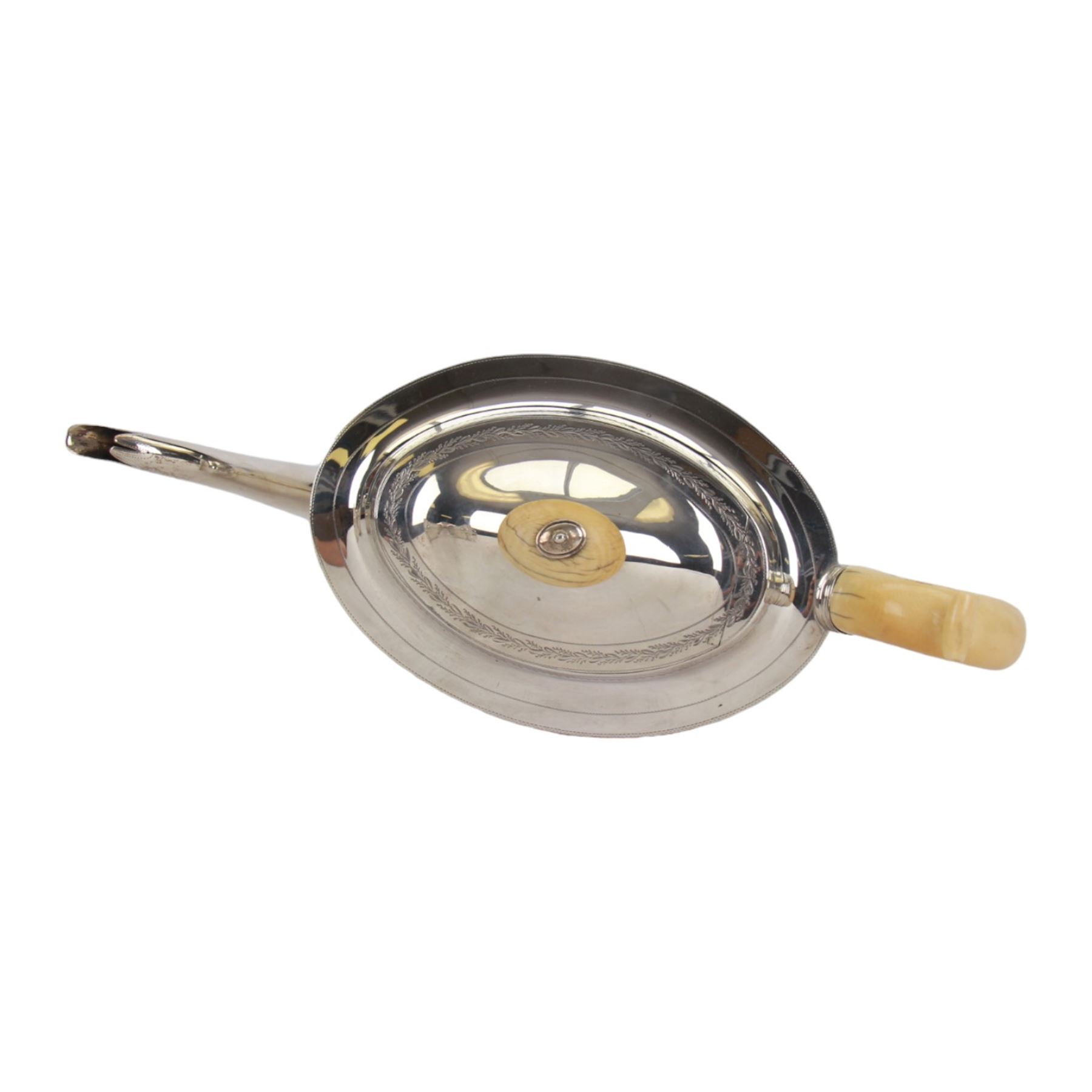 George III silver three piece tea service, comprising teapot with ivory scroll capped curved handle and ivory finial to the hinged cover, twin handled open sucrier with gilt interior, and cream jug with gilt interior, each of oval form with rounded sides, the bodies engraved with central monogram within a seaweed wreath, between engraved foliate bands, hallmarked John Emes, London 1801, teapot including handle H17cm

This item has been registered for sale under Section 10 of the APHA Ivory Act