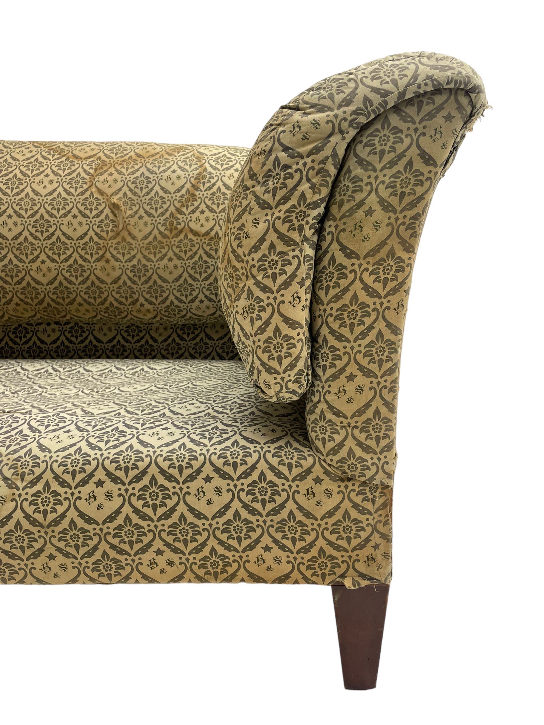 Howard & Sons - Edwardian mahogany framed two seat sofa, upholstered in original H&S foliate patterned fabric with sprung seat and overstuffed back and arms, raised on square tapering supports, the rear leg stamped '19600 1795 Howard & Sons Ltd Berners Street'