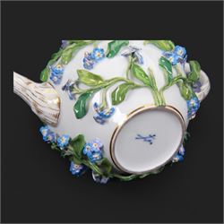Late 19th century Meissen teapot, of ovoid form with gilt detailed 'crabstock' effect handle and spout, the body encrusted with forget-me-not flowers and leaves and painted with a single moth, with underglaze blue crossed swords mark beneath, H10cm