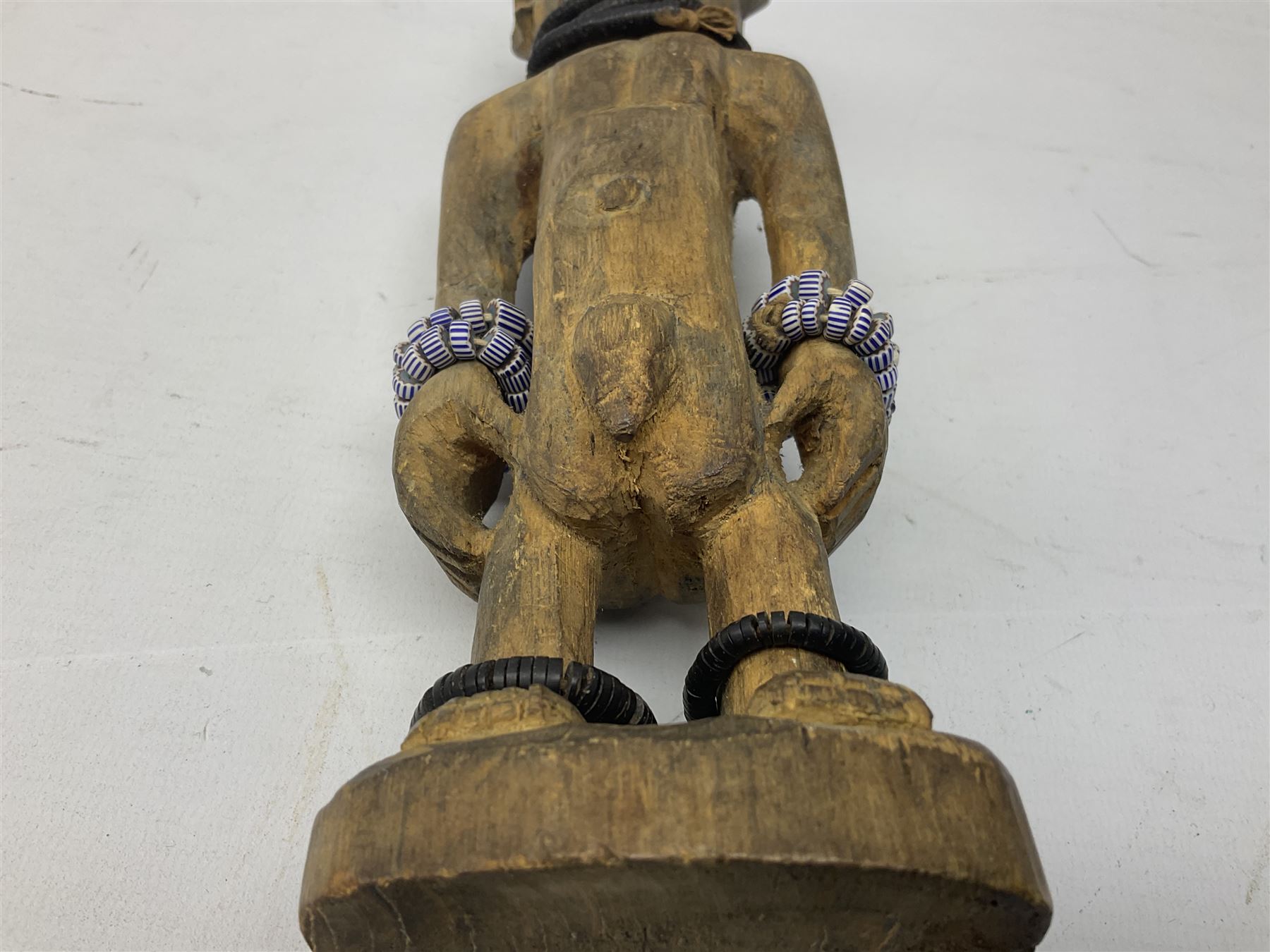 Early 20th century West African Yoruba family wooden figure of Orisha Oko, the god of farming/agriculture, carved from the solid, bears manuscript label of provenance verso H26.5cm