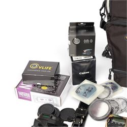 Canon EOS 90D DSLR camera body serial no. 064051002694, in a silicon camouflage case, with a Canon EF-S 17-85mm 1:4-5.6 Image Stabilising Ultrasonic zoom lens serial no. 4512926109, Canon Extender EF 1.4 x III and other accessories including Lowepro carry case, Visionary clamp, Canon Speedlite 430 EXII, Ultimaxx Grip Stabiliser, Newell Dual Battery Charger, Very100 sight, Olympus OM-D EE-1 dot sight, various filters, etc