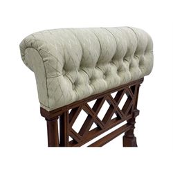 Late Victorian upholstered armchair, with high camel back and deep seat, padded arms and backrest in crimson and cream damask-style fabric, raised on turned ebonised front supports with ceramic castors (H88cm, W65cm, D 60m); and an Edwardian bedroom chair with button upholstered rail back (H72cm, D64cm, W53cm) (2)