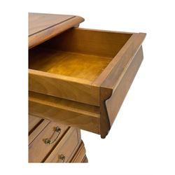French cherry wood kneehole desk or dressing table, moulded rectangular top over twin pedestal bases each housing three drawers with brass-effect swing handles, resting on bracket feet