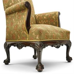 Pair of Chippendale design carved mahogany framed armchairs of stylised lyre form, high square backs and sprung seat upholstered in olive-ground foliate fabric, scrolled arm terminals with applied rosettes, the seat rail moulded with central scallop-and-acanthus motif, raised on shell-carved cabriole supports with ball-and-claw feet