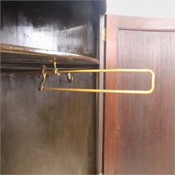 Edwardian inlaid mahogany cylindrical corner hall-robe, projecting cornice, figured veneer and crossbanded door, enclosing hanging hooks and shelf, raised on a plinth base with bracket feet