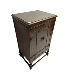 Early 20th century ‘HMV' 202 cabinet gramophone, oak cased, moulded top with foliate carved moulding hinges to reveal gramophone, two doors enclosing horn, on turned supports joined by moulded stretcher rails