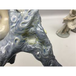 Four Lladro figures, comprising Touch of Class no 5377, Boy Student no 4517, Ocean Beauty no 5785 and Carnival Couple no 4882, largest example H45cm