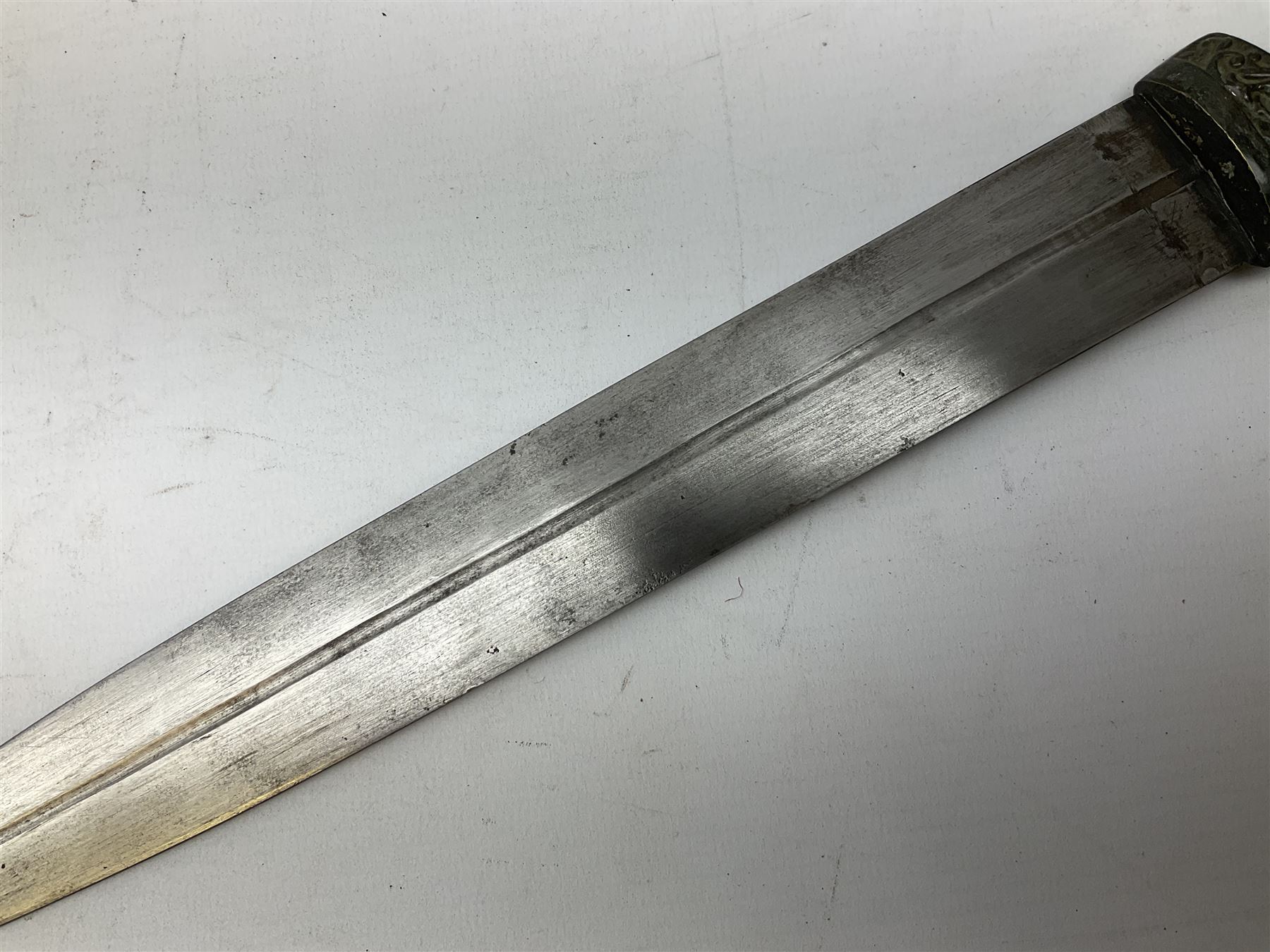 19th century Khanjali dagger, 33.5 cm double edged fullered blade with stamped makers marks, ornate cast grip, with engraved white metal scabbard, 46cm overall
