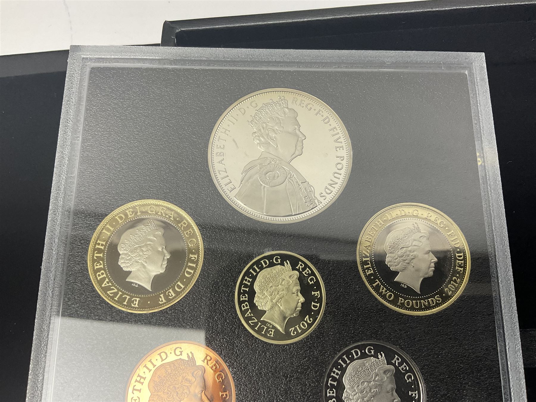 Mostly commemorative coinage, including various Queen Elizabeth II United Kingdom brilliant uncirculated fifty pence, two pound and five pound coins in card folders, The Royal Mint United Kingdom 2012 proof coin set, Alderney 2021 'Royal National Lifeboat Institution' five pound coin cover in Harrington and Byrne folder etc