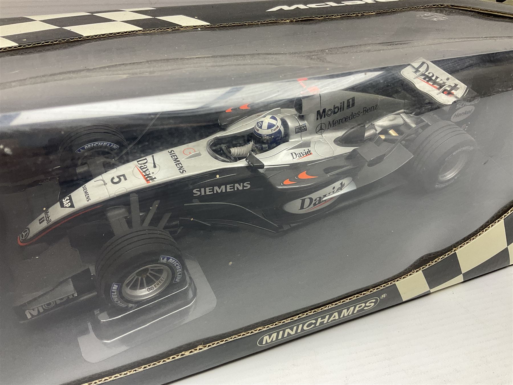 Three Minichamps 1:18 scale die-cast McLaren racing cars - Mercedes MP4-19 D. Coulthard; Mercedes MP4-20 K. Raikkonen; and Vodaphone Mercedes MP4-22 L. Hamilton 2007; all boxed (3)

