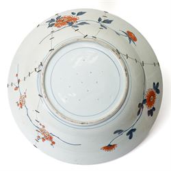 Japanese 18th century Edo period Imari porcelain charger, painted with a central peony in vase within a border of kiku and spotted shi-shi, D54cm 