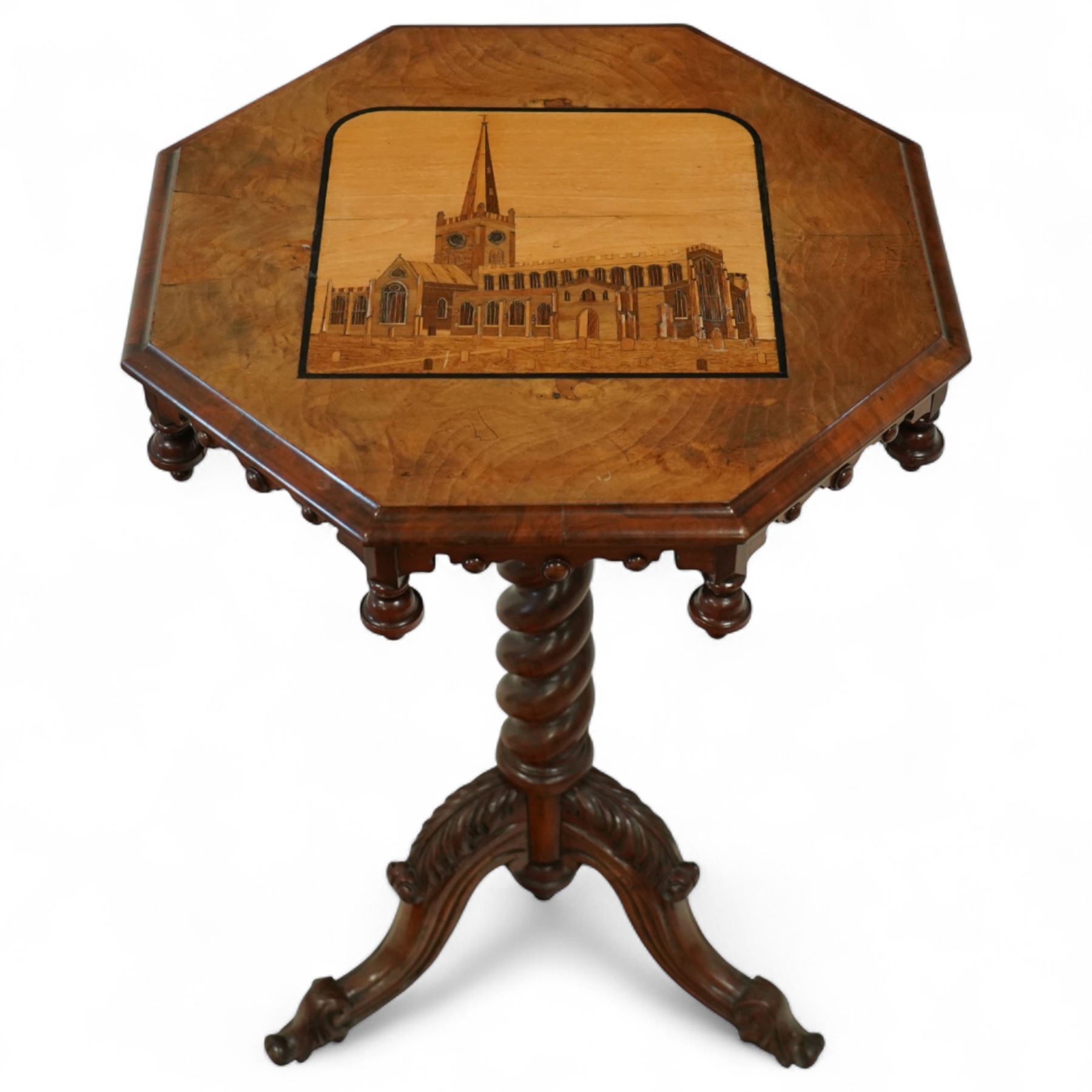 Victorian inlaid walnut occasional table, the octagonal top inlaid with a marquetry scene of Shakespeare's Church - The Holy Trinity at Stratford-Upon-Avon, over an ecclesiastical design frieze with turned finials and castellated form, raised on a spiral turned pedestal terminating to an acanthus carved tripod base with scroll feet, circa 1860