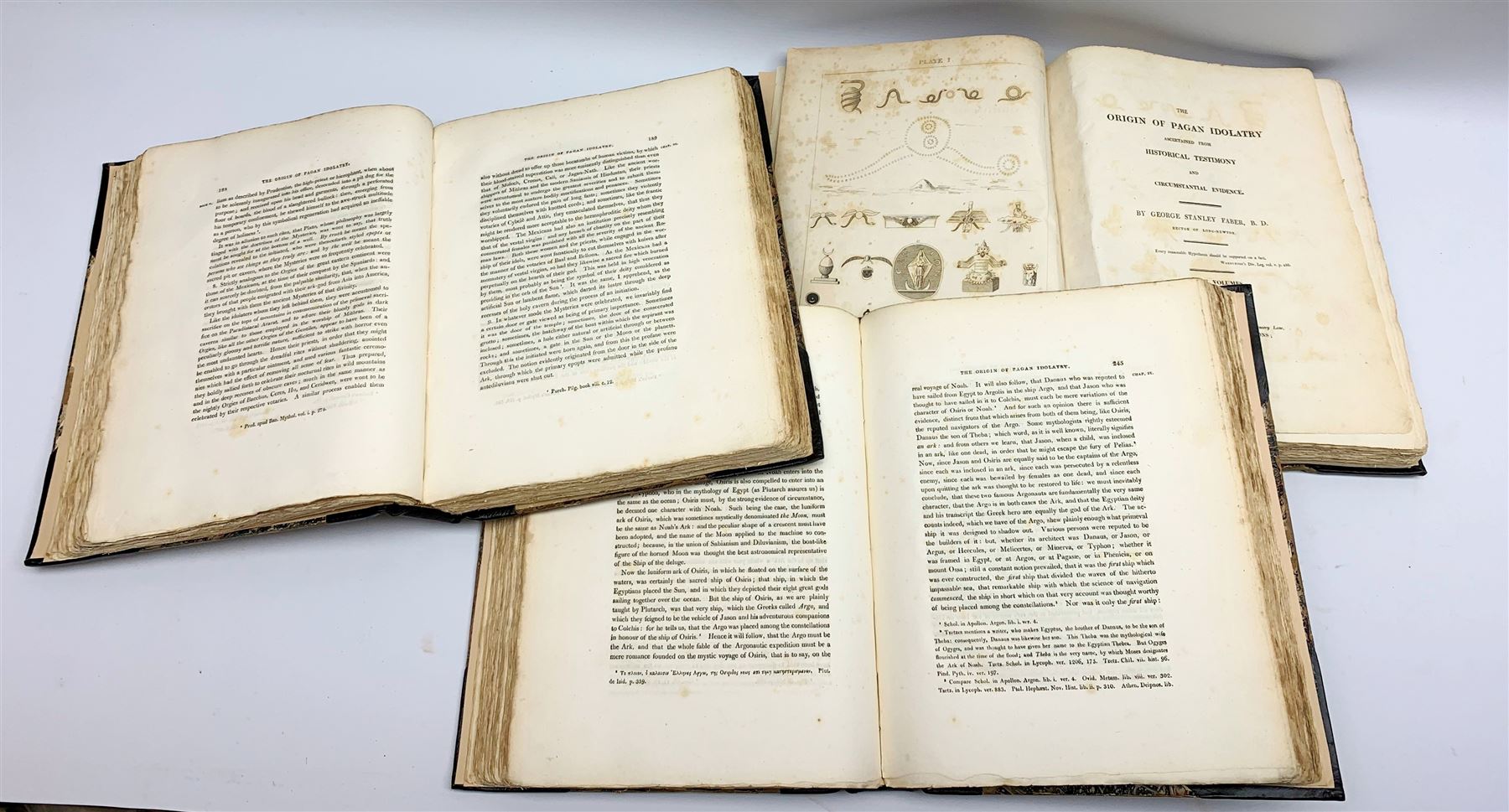 Faber George Stanley: The Origin of Pagan Idolatry. 1816. First edition. Three volumes. Uncut pages. Rebound in half leather with marbled boards and new end papers.