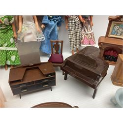 Seven Pippa dolls and a collection of plastic dolls house furniture